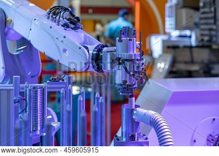 Automation System Robot Arm With Gripper During Bring Process Metal Ring Or Workpiece To Deburring P