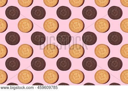 Pattern Of Cookies. Cookies On A Pink Background. Flat Lay. Ssandwich Cookies Filled With Sweet Crea