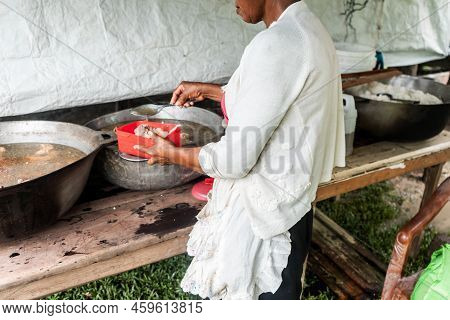 Indigenous Woman Cooking In Her Humble Home On The Caribbean Coast Of Nicaragua, Central America
