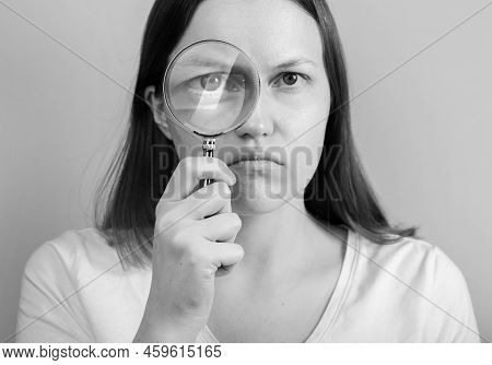 Person Looking Through Magnifying Lens Glass. Psychology Analysis Concept.