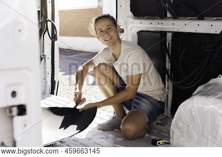 Happy Smiling Young Man Looking To Camera While Cutting The Rubber Insulation For The Rv Self Made C