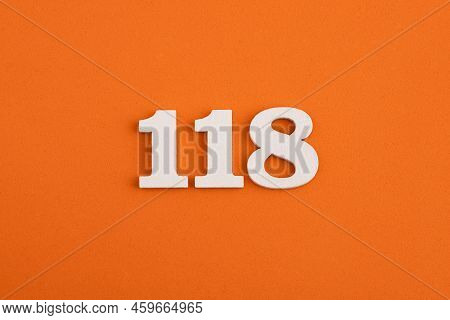 White Wooden Number 118 On Eva Rubber Orange Background