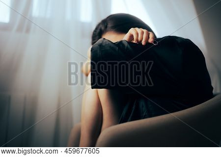 Sad Divorcee Holding Her Wedding Ring And Crying
