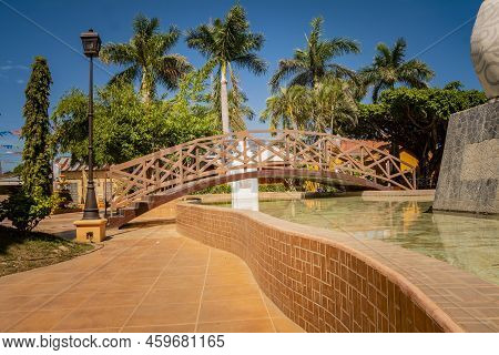Nagarote Central Park.  View Of A Nice And Relaxed Park With A Water Fountain. Traditional, Side Vie