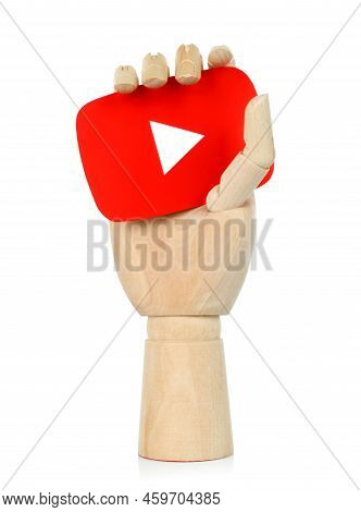 Kiev, Ukraine - May 04, 2022: Wooden Hand Holds Youtube Paper Icon, On White Background. Youtube Is 