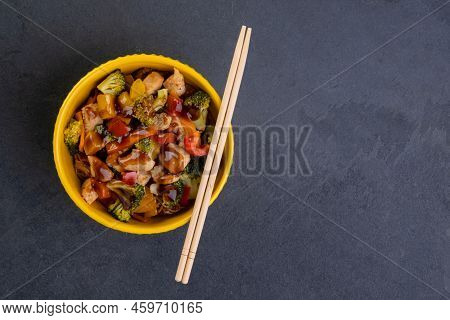 Chicken Yakissoba In Yellow Bowl On Slate Stone
