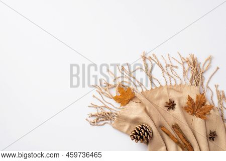 Autumn Mood Concept. Top View Photo Of Cinnamon Sticks Yellow Maple Leaves Anise And Pine Cone On Be