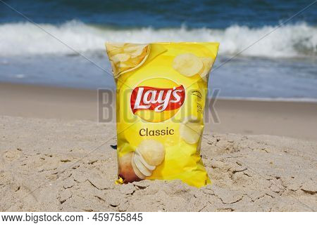 Dewey Beach, Delaware, U.s.a - August 13, 2022 - A Bag Of Lay's Potato Chips On The Beach