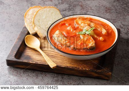 Fish Tomato Soup With Carp Steak, Vegetables And Paprika Close-up In A Bowl On The Table. Horizontal
