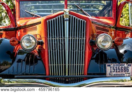 Apgar, Montana, Usa - 8.2022 - Red Bus Jammer Tour Vehicle At Glacier National Park.
