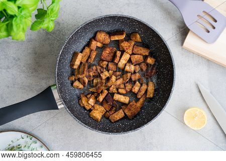 Top View Roasted Tempeh Or Tempeh, Made Of Fermented Soybean Seeds. Fried Cubed Tempeh In The Pan. S