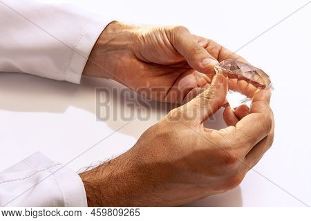 Closeup Hands Of Jeweler Holding Huge Gems At Work In Jewelry. Desktop For Craft Jewelry Making With