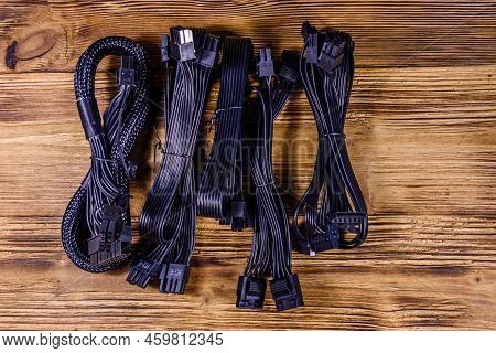 Set Of Computer Psu Cables On Wooden Background