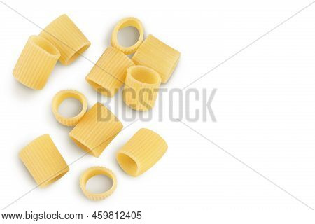 Raw Italian Pasta Isolated On White Background. Mezze Maniche Rigate Bronze Die. Top View With Copy 