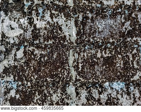 Dirty Old Eroded Cracked Plaster Cement Block Fence. Concrete Block Wall. Destroyed Crumbling Cement