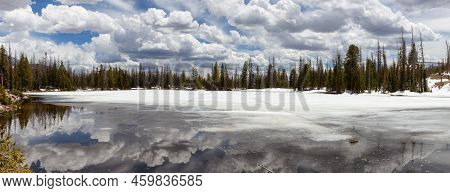 Panoramic View Lake Surrounded By Mountains And Trees In Amercian Landscape. Spring Season. Mirror L