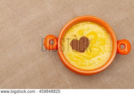 Homemade Sweet Corn Pudding Known In Brazil As Curau Or Canjica Nordestina In Ceramic Bowl. Powdered