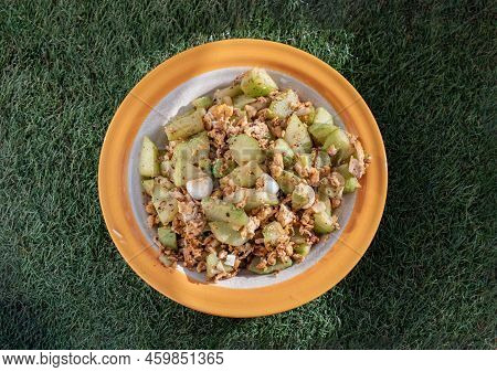Stir Fried Chayote With Eggs In Oyster Sauce On Ceramic Plate. Local Food, Top View, Copy Space, Sel