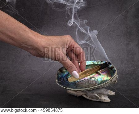 Palo Santo Burning In Front Of White Background