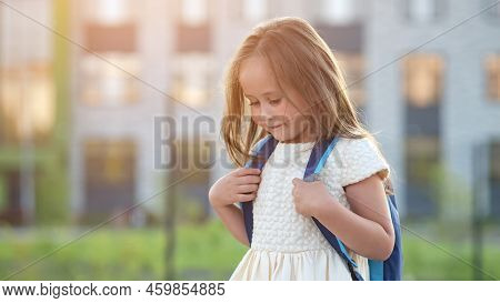 Shy Preschooler Girl Goes To Preparatory Form With Excited And Happy Expression. Girl Holding School