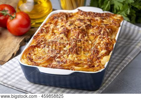 Pasta Casserole Bechamel Sauce Topped With Melted Mozzarella Cheese And Served In A White Baking Dis