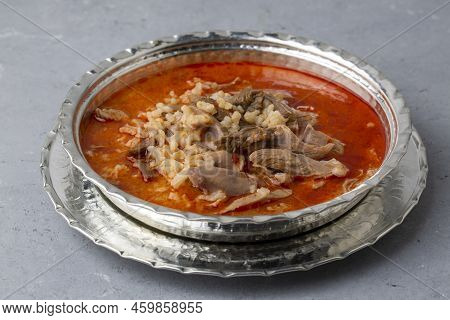 Turkish Soup Beyran With Lamb Meat, Rice, Chopped Garlic And Vinegar Sauce. Traditional Organic Food
