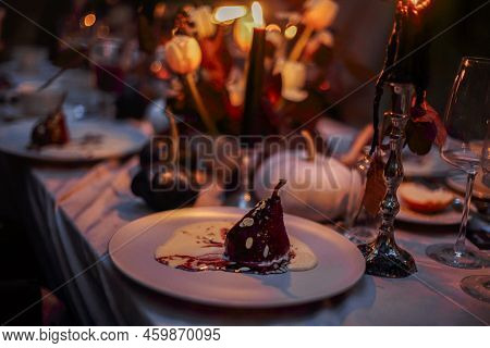 Selective Focus Of Pear Dessert With Sabayon, Italian Zabaglione Sauce On Plate Served On Dinner Tab