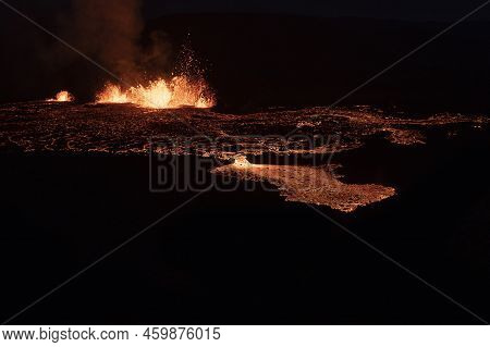 Volcano Eruption At Meradalir Near Fagradalsfjall, Iceland. Erupting Magma And Flowing Lava At Night