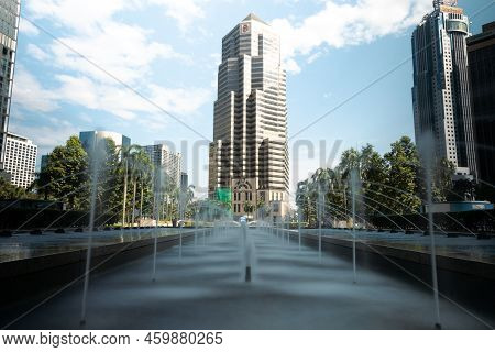 Kuala Lumpur, Malaysia - August 13, 2022: The Water Fountain In Front Of The Kl Twin Towers. Long Ex