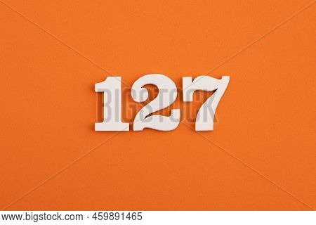 Number 127 - On Orange Foam Rubber Background