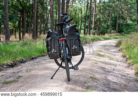 Harskamp, Gelderland, The Netherlands - 07 14 2022 - Trekking Bike On A Cyclist Road In The Veluwe N