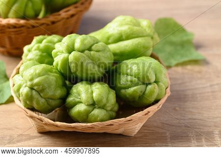 Chayote Squash Fruit In Basket On Wooden Table, Organic Vegetables