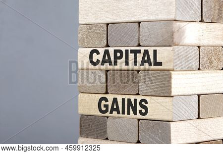The Text On Wooden Blocks Capital Gains