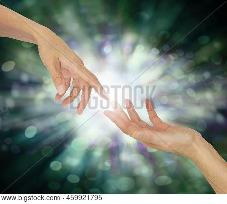 Receiving A Reiki Attunement Concept - One Hand Touching Another Hand With White Light Between Again