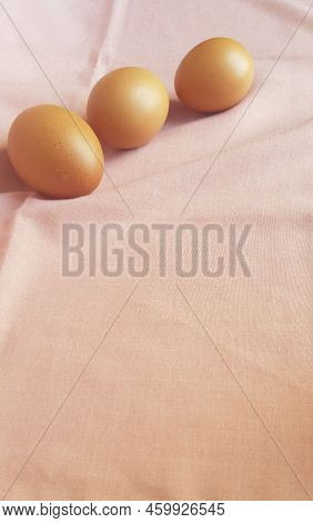 A Few Eggs On A Pink Cloth.