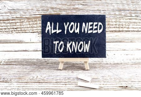 All You Need To Know Text On Miniature Chalkboard On Wooden Background
