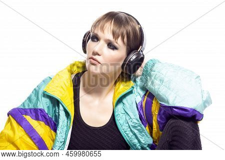 Closeup Portrait Of Young Caucasian Female  Sportwoman In Fitness Outfit Wearing Wireless Phones Whi