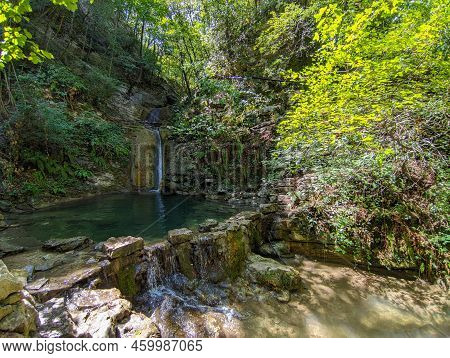Idyllic Waterfall In The Forest Near Cagli In The Marche Region During Summer Season Italy