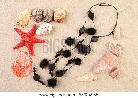 Summer concept - sand stones and seashells frame