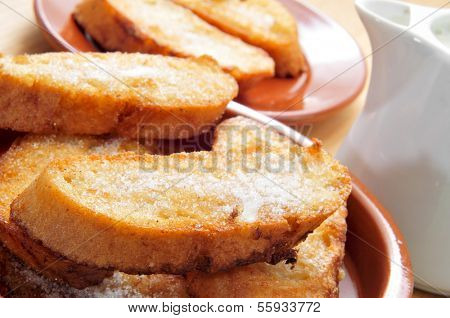 a plate with torrijas, typical spanish dessert for Lent and Easter, on a table