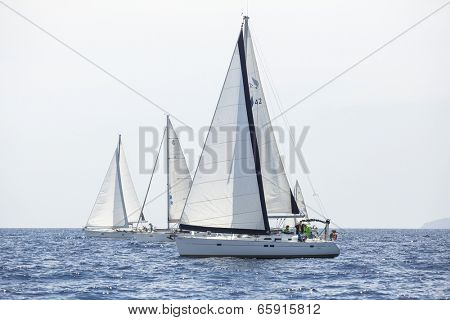 AEGEAN SEA, GREECE - APR 27, 2014: Unidentified sailboats participate in sailing regatta 