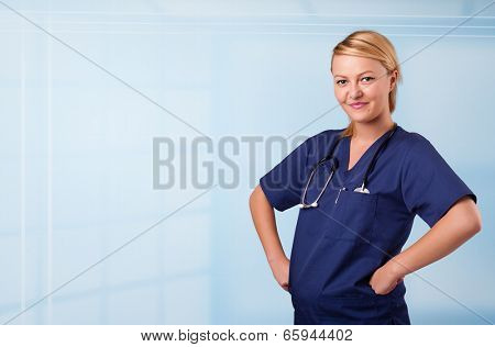Pretty young nurse in hospital listening to empty copy space with sthetoscope