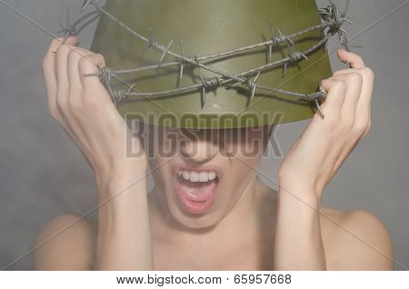 Woman In Military Helmet With Barbed Wire Screams