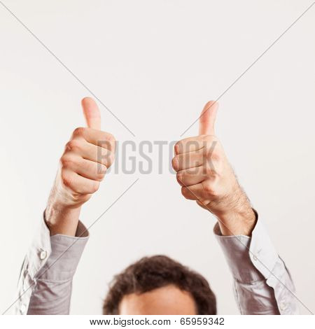 close up of young thumbs up isolated