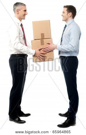 Smiling Young Men Receive Cartons Boxes