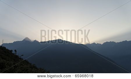 Sunlight shafts over mountains