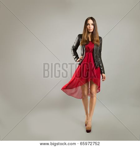 Woman in Red Dress on Gray Backgound