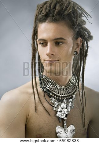 Handsome Guy With Dreadlocks And Jewelry
