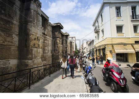 ATHENS, GREECE - MAY 10, 2014: Athenians and tourists in center of city. Tourism is a decisive sector of hope for Greek economy - In the year Greece receives about 18 million tourists. 