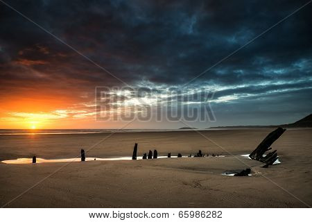 Beautiful Dramatic Sunset Landscape Over Shipwreck On Rhosilli Bay Beach